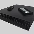 Modern Black Entertainment Media Player With Remote Control And Cassette Tape On Top