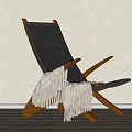 Modern Lounge Chair With Woven Design Wooden Frame And Cozy Blanket In Living Space
