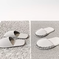 Gray and White Slippers on Soft Fluffy Carpet for Cozy Home Use