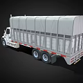 White Commercial Cargo Truck With Canvas Covered Bed And Dual Rear Wheels