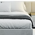 Modern Double Bed With Velvet Frame White Linens Gray Throw And Bedside Table Drawers