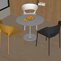 Modern Dining Table Set with Round White Tabletop Three Colored Chairs and Oranges on Top 3d model
