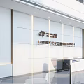 Modern Front Desk Reception Area With Spacious Lobby High Ceiling Glass Railings And Natural Light