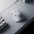 Ergonomic Wireless Mouse On Modern Desktop With Mechanical Keyboard And Notebook Paper Setup