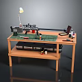 Weapon Assembly Process On Wooden Workbench With Tools Laptop Lamp And Paints