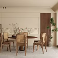 Modern Restaurant Interior With Round Wooden Table Rattan Chairs Plant And Wall Art