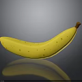 Ripe Yellow Banana With Brown Spots And Stem On Dark Background