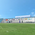 Modern Commercial Building Design With Flat Roof Roadside Storefronts And Green Area