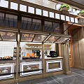 Cake Shop Storefront With Striped Awnings Wooden Door Display Cases Green Plants And Pastries