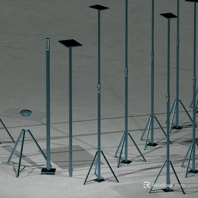 Sturdy Wrought Iron Poles With Triangular Stands Neatly Arranged On Outdoor Ground 3d model 