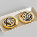 Tasty Spiral Pastries with Dark Swirl Filling on Ivory Ceramic Tray