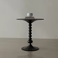 Black Side Table With Round Top And Spherical Beaded Base Featuring White Cup And Books 3d model