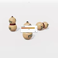 Three Decorative Gourd Ornaments With Red Straps And Green Labels On White Background