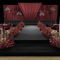 Elegant Wedding Stage Setup With Red Curtains Floral Arrangements And Chandeliers