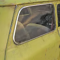 Vintage Green Small Car With Classic Design And Retro Exterior Features