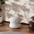 Modern Round White Accent Chair With Textured Surface Light Green Accent Strap And Plant Shadow