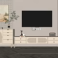 White TV Stand With Drawers Ornaments And Green Plant Next To Wall Mounted TV