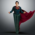 Man in Superman Costume Standing with Red Flowing Cape on Green Column Base