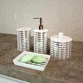 Elegant Bathroom Accessories with White Lilies Vase Silver Containers and Toiletries Bottles