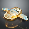 Golden Decorative Emblem With Blue Wings And Engraved Details On Shiny Surface