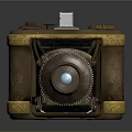 Vintage Folding Camera Equipment With Brass Body Yellow Trim Intricate Carved Patterns And Blue Lens
