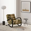 Floral Pattern Accent Chair With Black Curved Armrests Small Round Side Table And Floor Lamp