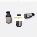 Three Dark Glass Bottles With EXMINA Label And Closed Caps On White Background