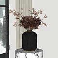 Black Textured Ceramic Vase With Dried Red Brown Branches Placed By Window With Snowy View