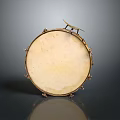 Vintage Circular Musical Drum With Light Colored Head And Metal Decorations