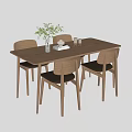 Wooden Dining Table with Four Modern Chairs Decorated with Green Plant Vase Teacup and Book