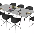 Modern Conference Table With White Top Black Chairs Laptop Flower Vase Coffee Mug And Documents