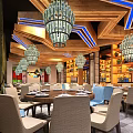Modern Restaurant Interior Design With Wooden Ceiling Blue Accents Large Screens And Decorative Plants