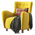 Yellow Armchair with Plaid Pillow and Gray Blanket on Wooden Legs