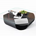 Modern Glass Top Coffee Table With Black Base Magazine And Green Fruit Bowl