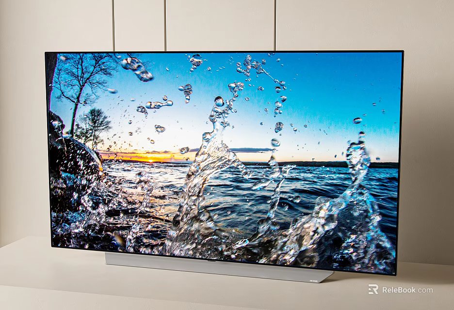 High Definition Television Showing Vibrant Water Splash Scene and Sunset Landscape 3d model 