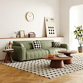 Green Double Sofa With Throw Pillows And Wooden Coffee Tables Holding Fruits And Books