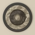 Round Wall Decor With Black Metal Frame And Light Textured Panel Mounted On Beige Wall