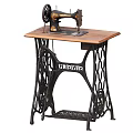 Vintage Singer Sewing Machine On Wooden Table With Intricate Metal Frame