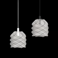 Two White Spiral Shaped Pendant Lights Hanging In Gray Interior Space