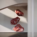 Hanging Red Stone Sculptures With Textured Surface In White Wall Light 3d model