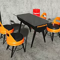 Modern Dining Table Set With Black Glass Top Orange Chairs And Freedom Logo