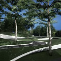 Modern Building Facade With Curved Structure Greenery Trees And Pedestrian Pathway 3d model