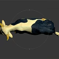 White And Blue Spotted Cow Model With Yellow Horns On Dark Surface