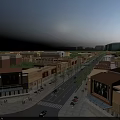Vibrant Sunlit Commercial Street With Modern Multi Story Buildings Pedestrians Shops And Cars