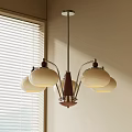 Modern Chandelier Featuring White Glass Shades Metal Arms and Natural Light Near Window with Blinds