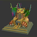 Golden Sphinx Sculpture With Green Branches Leaves And Stone Base