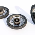 Detailed View of Three Motorcycle Tires with Wheels and Spokes on White Background