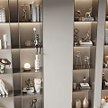 Modern Decorative Ornaments Set On Display Shelves With Sculptures Vases Books And Metal Artworks