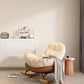 Cream Single Sofa With Brown Base Grey Blanket And Camera On Small Side Table