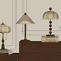 Stylish Table Lamps On Wooden Cabinet With Decorative Books And Green Plant